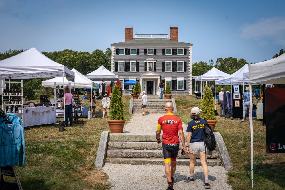 A photo of the Fine Arts & Crafts Festival in the front of the Codman Estate