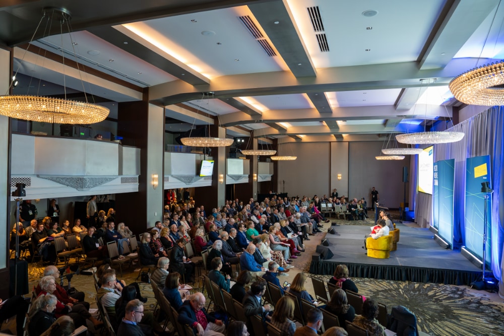 A crowd viewing a panel discussion at the 2024 Hisatoric New England Summit.