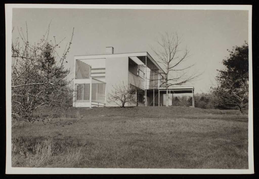 A photo of the outside of Gropius House from a vantage point a ways away.