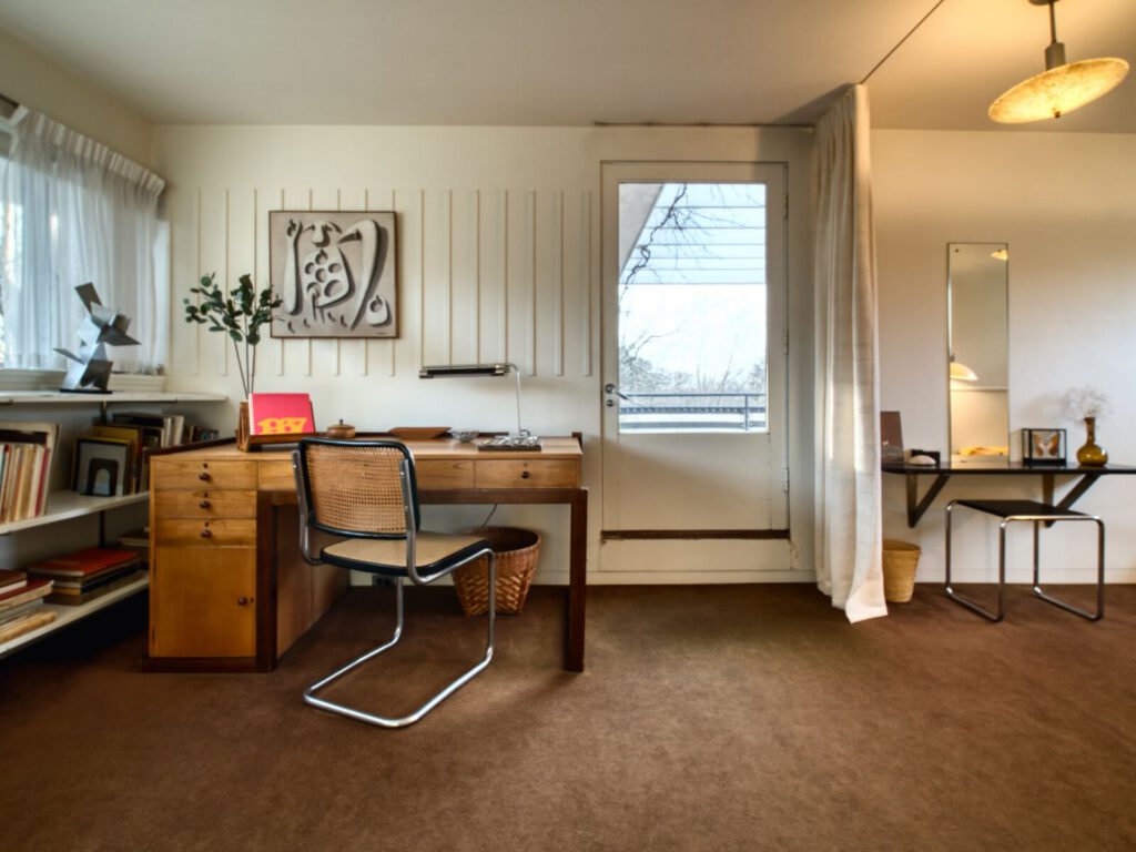 Weimar Desk, 1923, birch & cherry Designed by Walter Gropius for his office in the Weimar Bauhaus, this piece of furniture is the oldest in the house. It was handcrafted in the woodwork shop of the Bauhaus school in 1923. This desk served Gropius well during the years in Weimar and Dessau until 1928 when he took it to Berlin for use in his architectural practice. Part of the desk, the four glass shelves and the wooden support brackets on the right side, were broken in the transport to America and were never repaired or replaced. In 1938 when the family moved into the Lincoln house, Ati, Walter and Ise's twelve-year-old daughter, chose to have this desk in her bedroom.