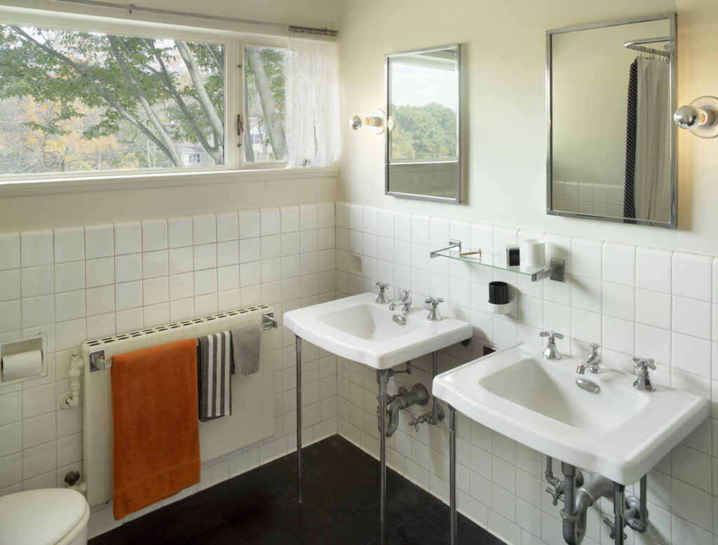 The bathroom in Gropius House showing two sinks with mirrors.