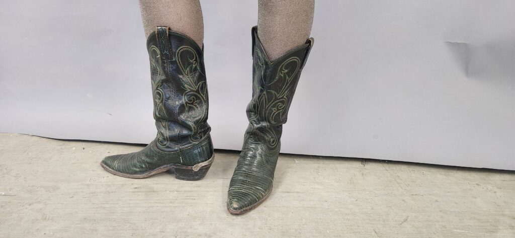 Cowboy boots with green lizard skin last.