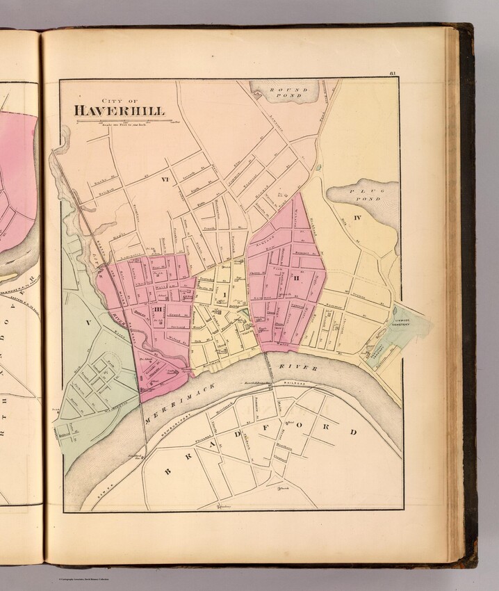 A multi-colored map of downtown Haverhill, showing a range of streets and two railroad lines, one headed north-south through downtown, and one headed east-west along the southern part of the map.