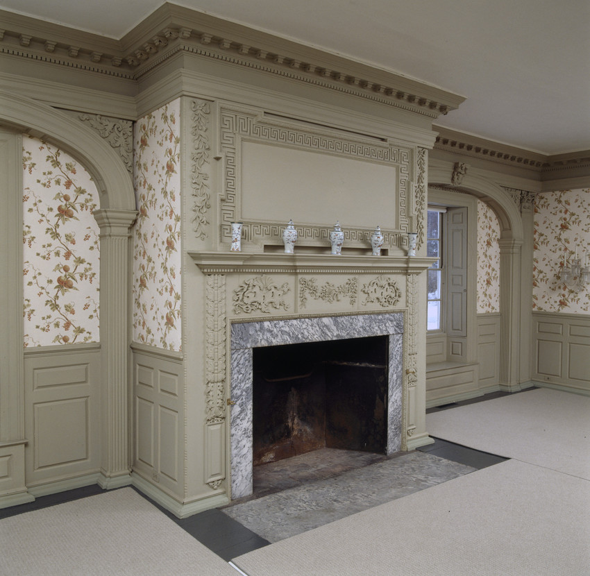 elaborate carved fireplace and mantle