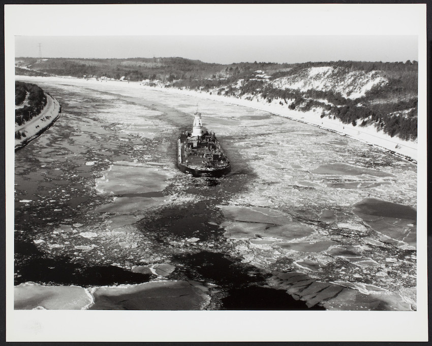 A ship traverses an icy Cape Cod canal