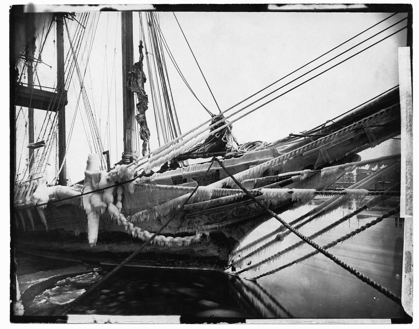 Docked schooner covered in ice