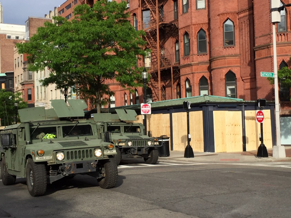 Two armored vehicles line the streets in downtown Boston in anticipation of protests about George Floyd's murder.