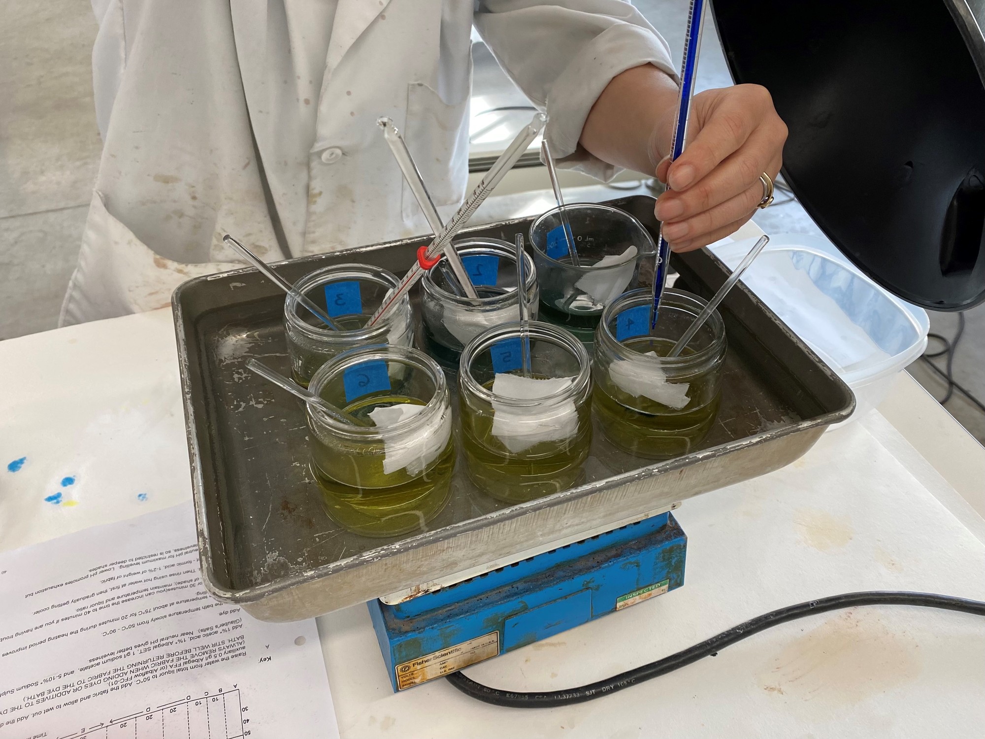 Conservationist testing dye formulas in a lab
