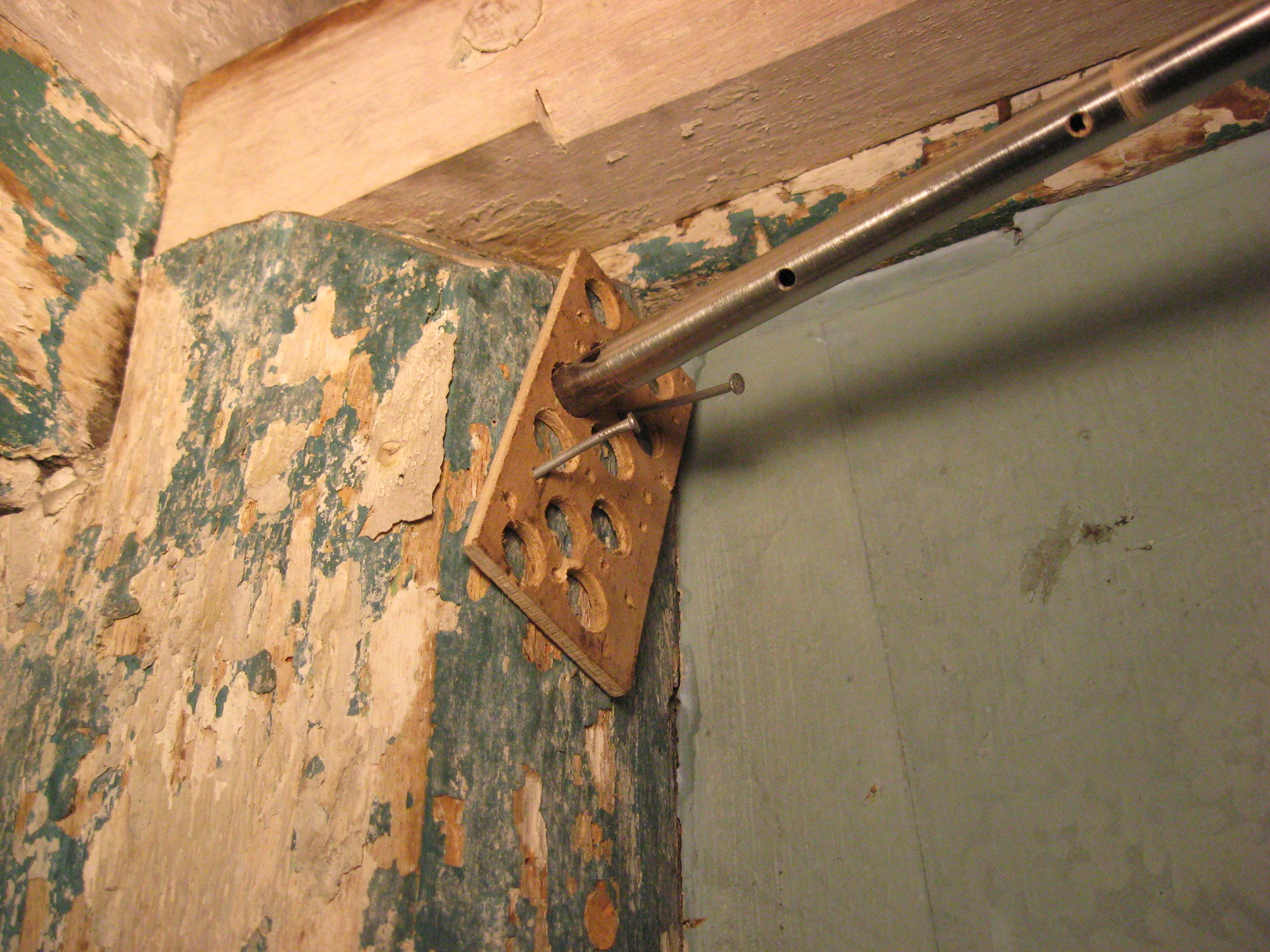 Wooden beam with hollow metal rod shoved inside in order to harvest wood core.