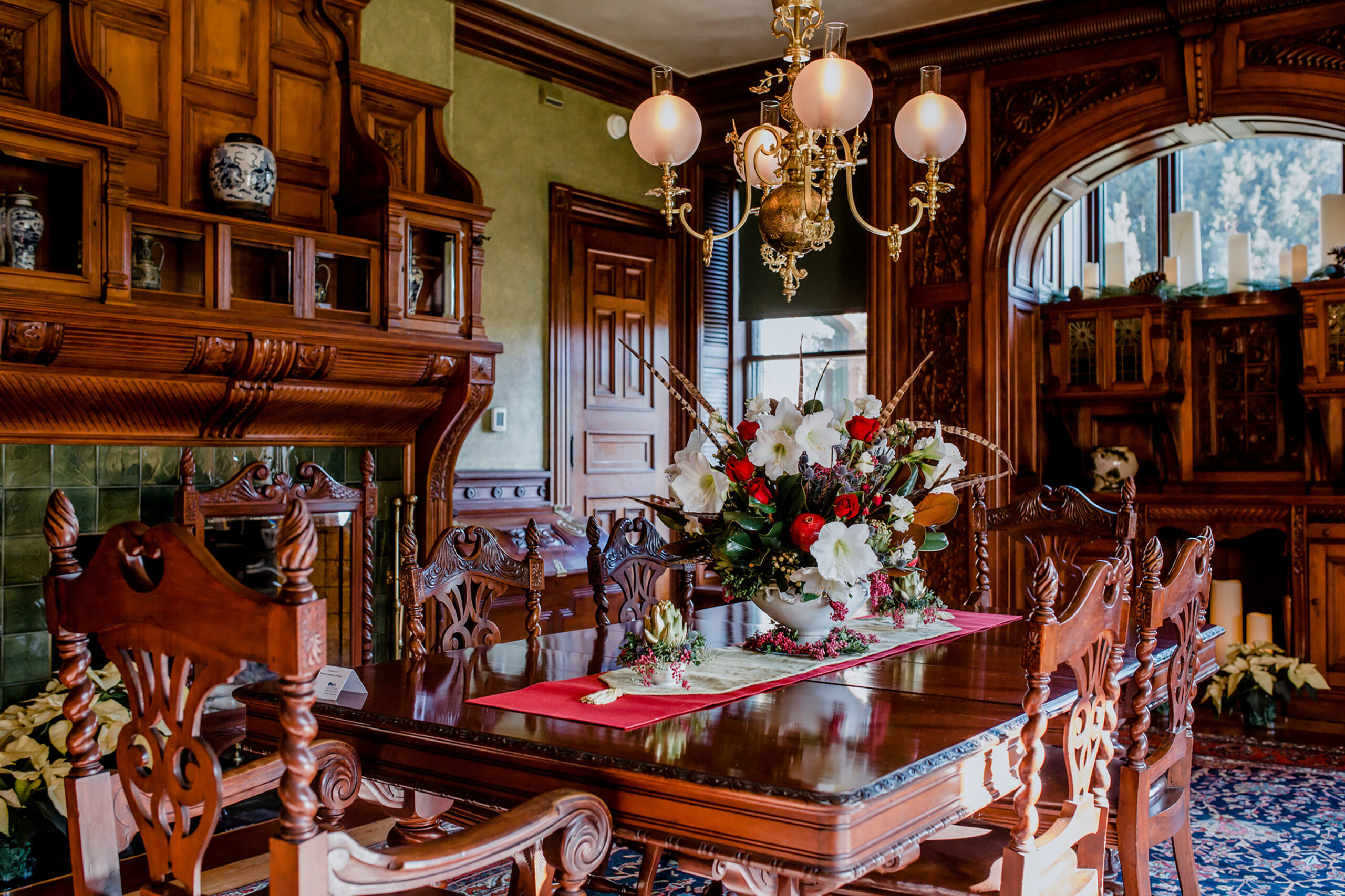Wooden table with large floral arrangement