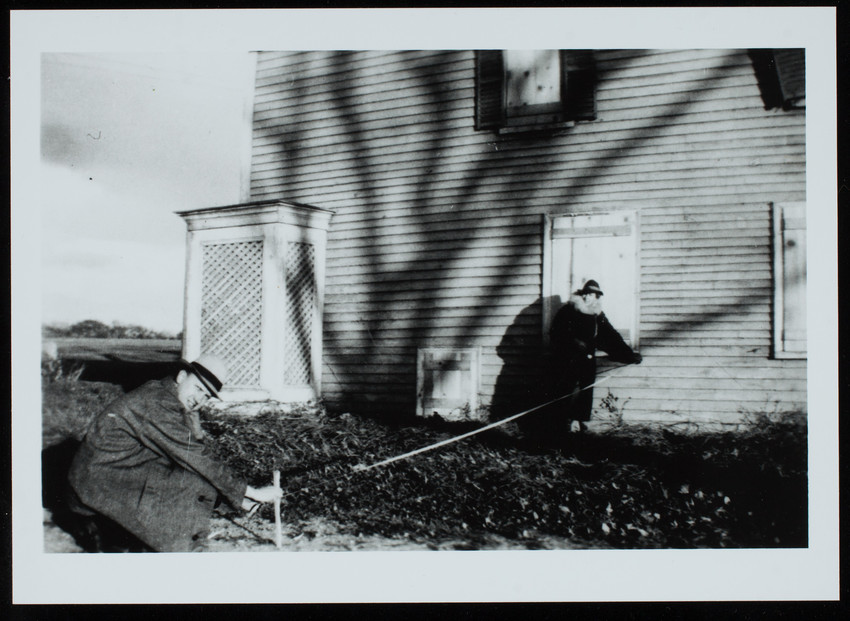 Bert and Nina Little taking measurements outside in order to add onto the main house at Cogwell's Grant