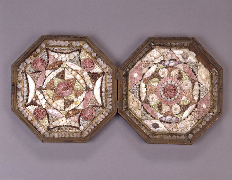 Octagonal artwork using shells and paper.