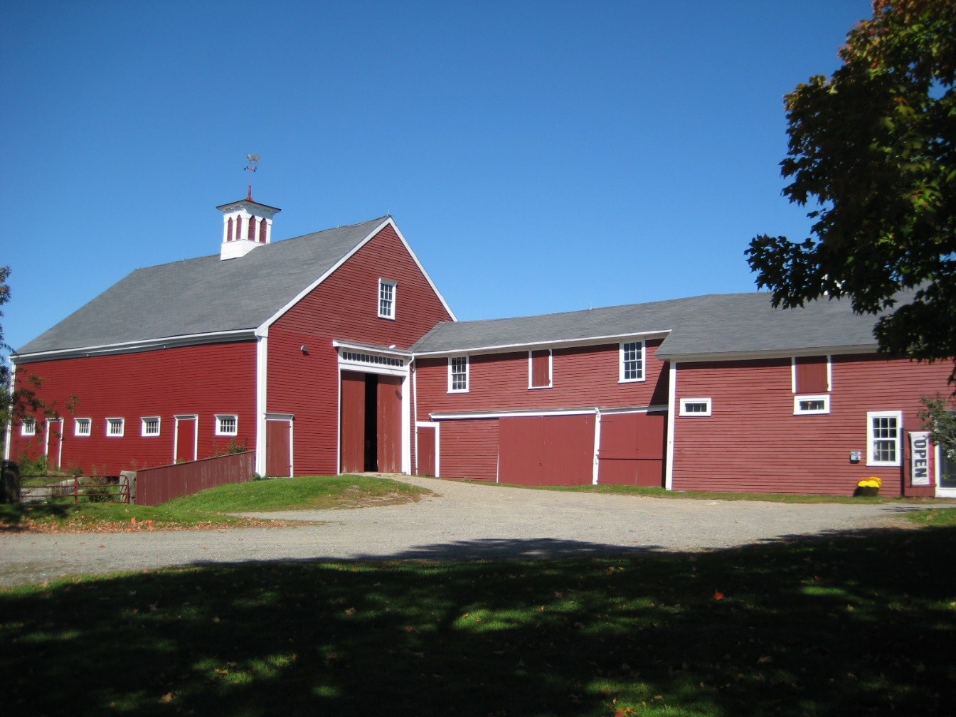 Large red barn with red barn connector to milk shed