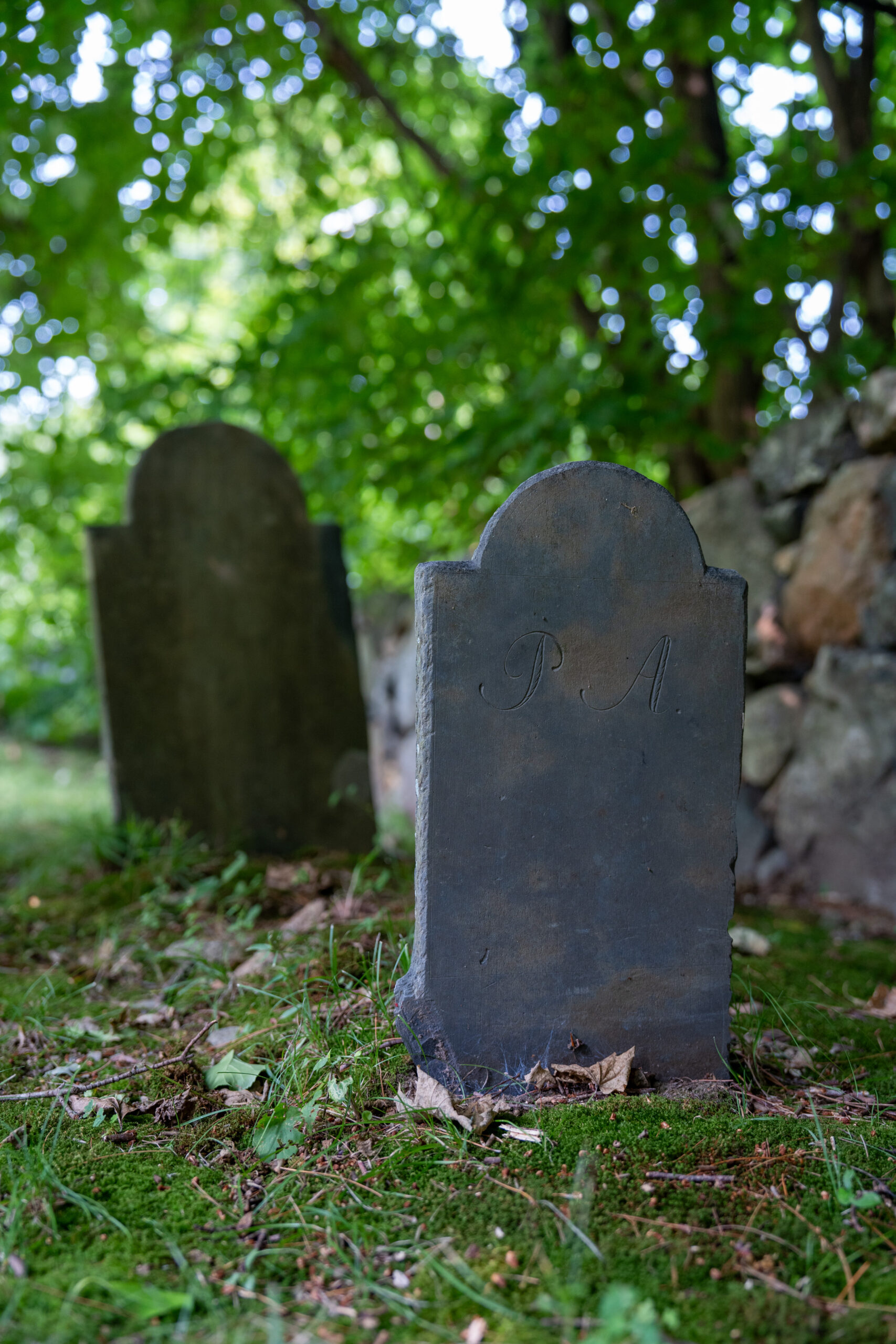 Graveyard with two marker. P.A. is legible in on the marker in the foreground.