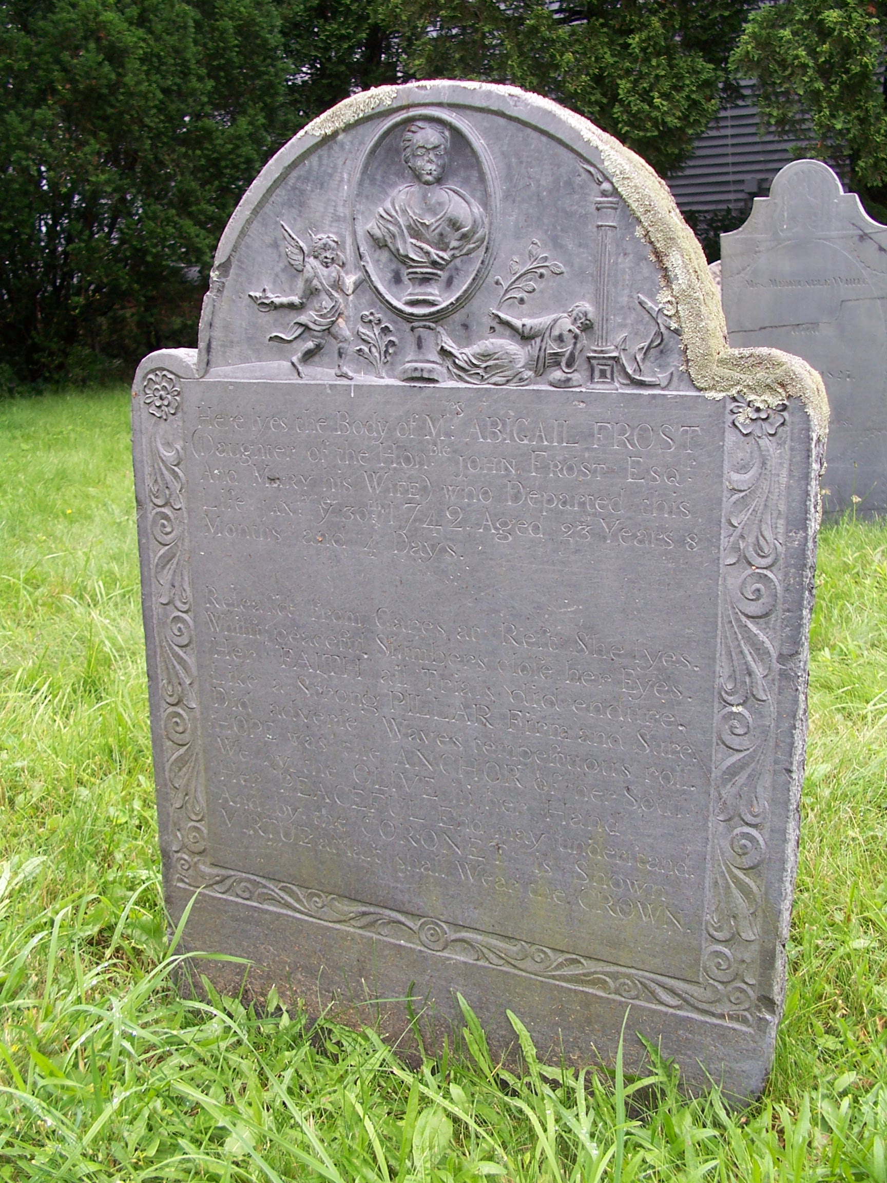 Ornate headstone for Abigail Frost, who died in 1742 at the age of 23.