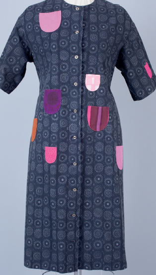 Dark blue dress with colorful patches and geometric patterns.