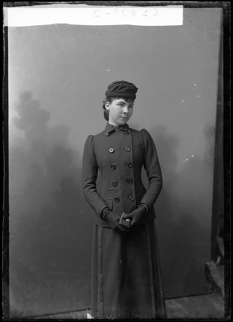 Black-and-white portrait of a woman in formal Victorian attire.