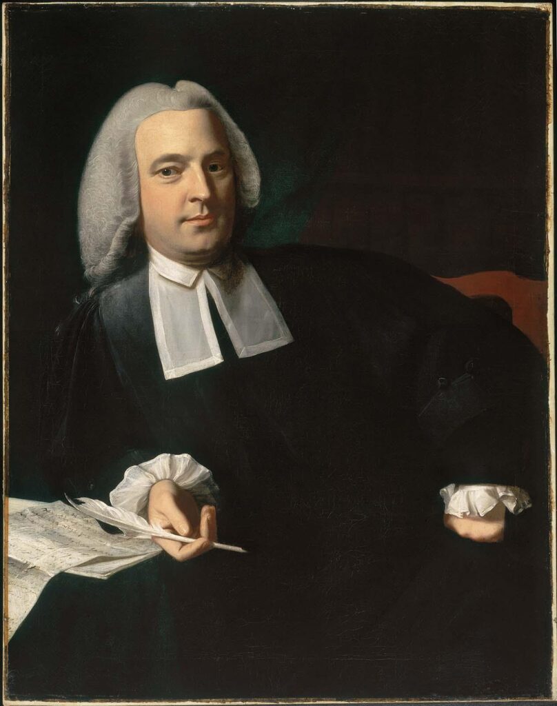 Portrait of a man in 18th-century attire, holding a quill, with a calm expression and lush white hair.