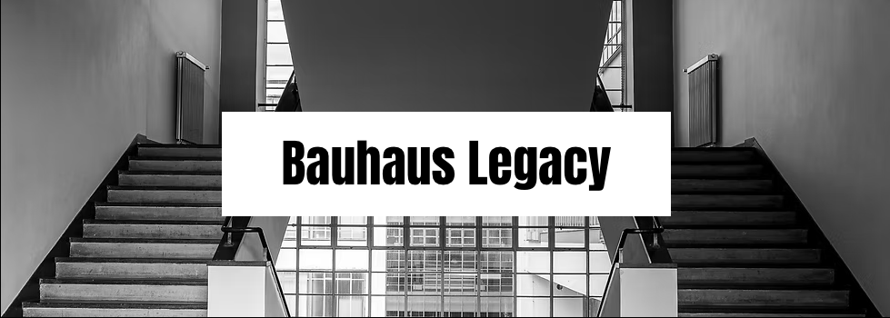 ALT Text: Symmetrical Bauhaus staircase with large windows, highlighting minimalist design and geometric lines.