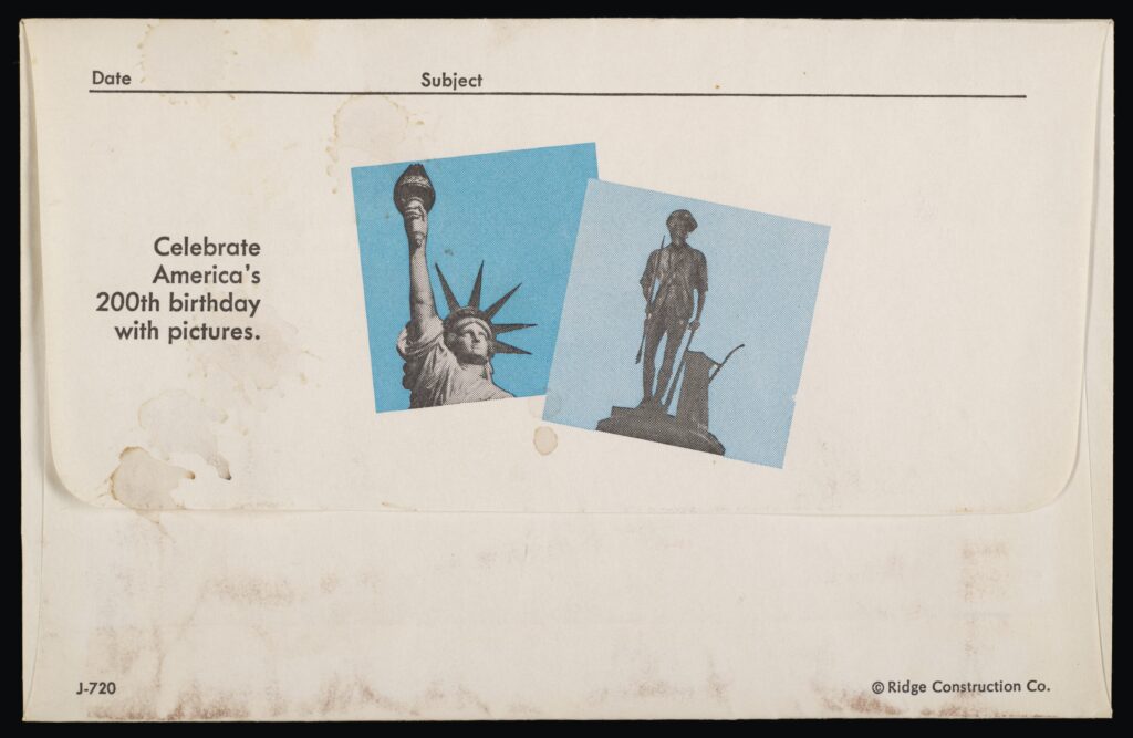 Images of the Statue of Liberty and the Minute Man on a vintage envelope. Text: Celebrate America's 200th birthday with pictures.