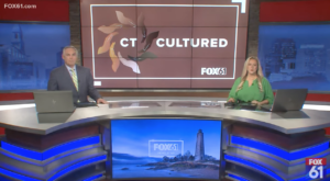 Fox61 news anchors presenting CT Cultured segment in the studio with digital display and laptops.