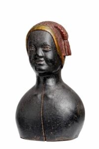 Antique wooden bust of a woman wearing a detailed headscarf. 18th-century African-American sculpture.