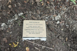 Memorial plaque for Patience, liberated in 1793, symbolizing freedom from generational enslavement.