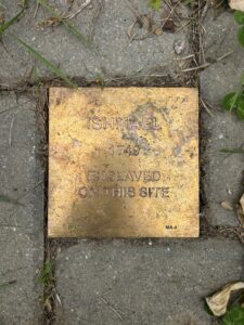 Memorial plaque for Ishmael, 1749, marking site of historical enslavement.