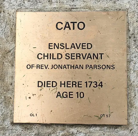 Memorial plaque for Cato, enslaved child servant of Rev. Jonathan Parsons, who died in 1734 at age 10.