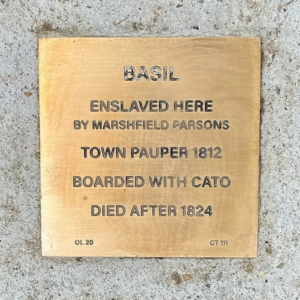 Bronze plaque honoring Basil, enslaved by Marshfield Parsons, town pauper 1812, and boarder with Cato, died after 1824.