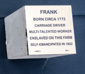Plaque honoring Frank, born circa 1772, carriage driver, multi-talented, self-emancipated in 1802, once enslaved.