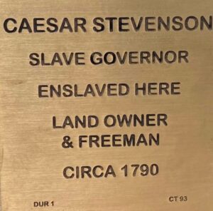 Bronze plaque honoring Caesar Stevenson, slave governor, enslaved here, landowner and freeman, circa 1790.