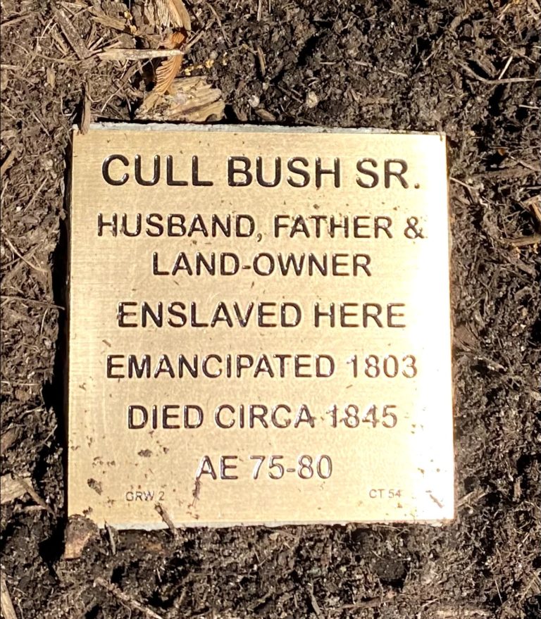Plaque honoring Cull Bush Sr., husband, father, landowner; enslaved, emancipated 1803, died circa 1845, aged 75-80.