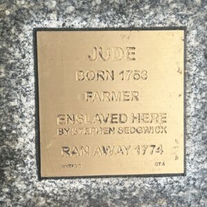 Bronze plaque honoring Jude, born 1753, a farmer enslaved by Stephen Sedgwick, who ran away in 1774.