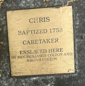 Plaque commemorating Chris, baptized 1758, enslaved caretaker by Rev. Benjamin Colton and Abijah Colton.