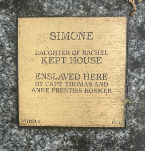 Bronze plaque honoring Simone, daughter of Rachel, enslaved by Capt. Thomas and Anne Prentiss Hosmer.