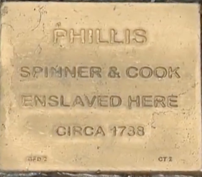 Commemorative plaque for Phillis, a spinner and cook enslaved circa 1738. Honor historical figures and heritage.