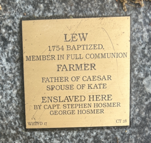 Commemorative plaque for Lew, a baptized farmer, father, spouse, and enslaved by Hosmer captains in 1754.