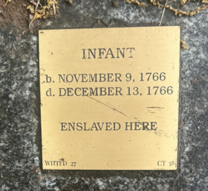 Commemorative plaque for an enslaved infant, born and died 1766 at this site.
