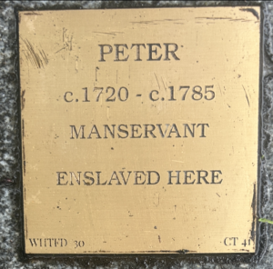 Bronze plaque for Peter, circa 1720-1785, manservant enslaved at this location, somber historical marker.