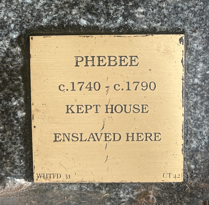 Historical plaque honoring Phebee, an enslaved person, from circa 1740-1790, who maintained the house.