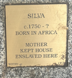 Plaque honoring Silva, born in Africa circa 1750, enslaved and housekeeper. Historical remembrance and heritage marker.