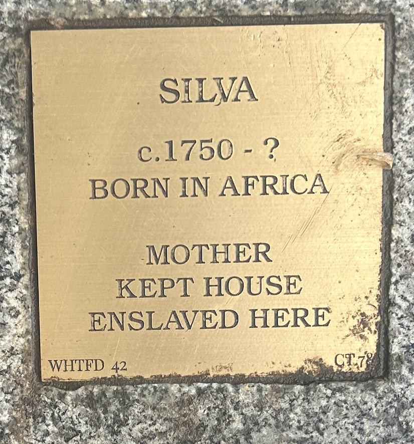 Plaque honoring Silva, born in Africa circa 1750, enslaved and housekeeper. Historical remembrance and heritage marker.
