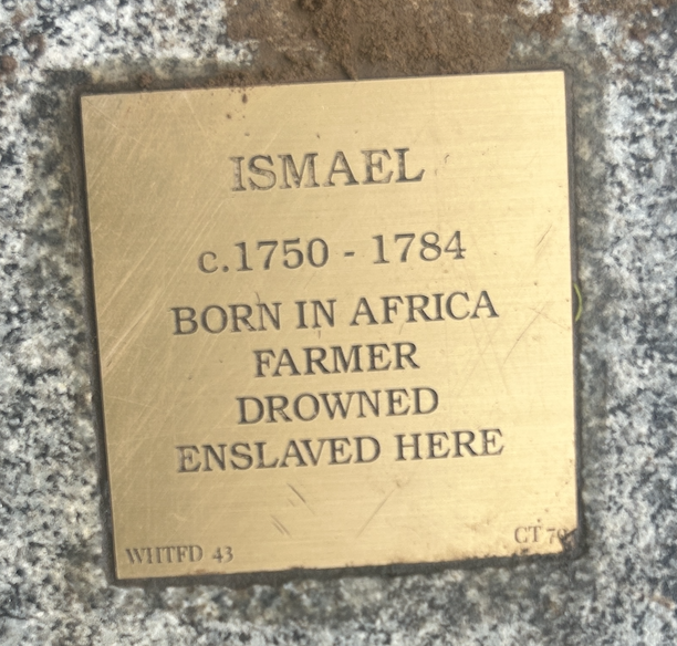 Memorial plaque for Ismael, c.1750-1784: Born in Africa, farmer, drowned, enslaved. Historical remembrance.