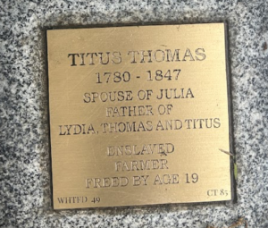 Bronze plaque honoring Titus Thomas (1780-1847): spouse, father, formerly enslaved, farmer, freed at 19.