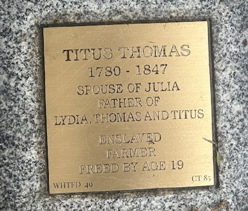 Bronze plaque honoring Titus Thomas (1780-1847): spouse, father, formerly enslaved, farmer, freed at 19.
