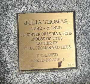 Julia Thomas memorial plaque on granite: born 1782, freed from enslavement by age 3, daughter, spouse, mother.