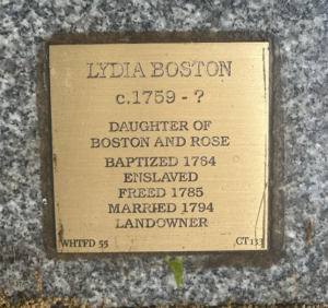 Bronze plaque for Lydia Boston c.1759-?, details life from baptism to freedom and marriage, historical significance.
