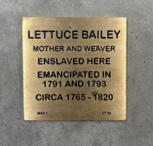 Bronze plaque honoring Lettuce Bailey, mother and weaver, enslaved, and emancipated in 1791 and 1793. Circa 1765-1820.