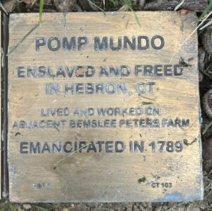 Plaque honoring Pomp Mundo, enslaved and freed in Hebron, CT, lived on Bemslee Peters Farm, emancipated in 1789.